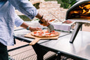 Ooni-pizza-snijden_a2b1c63d-224e-4643-a0cd-9e3d09928fd7